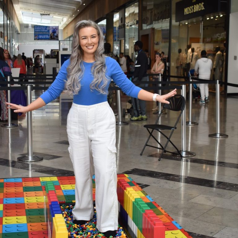 woman standing on Lego