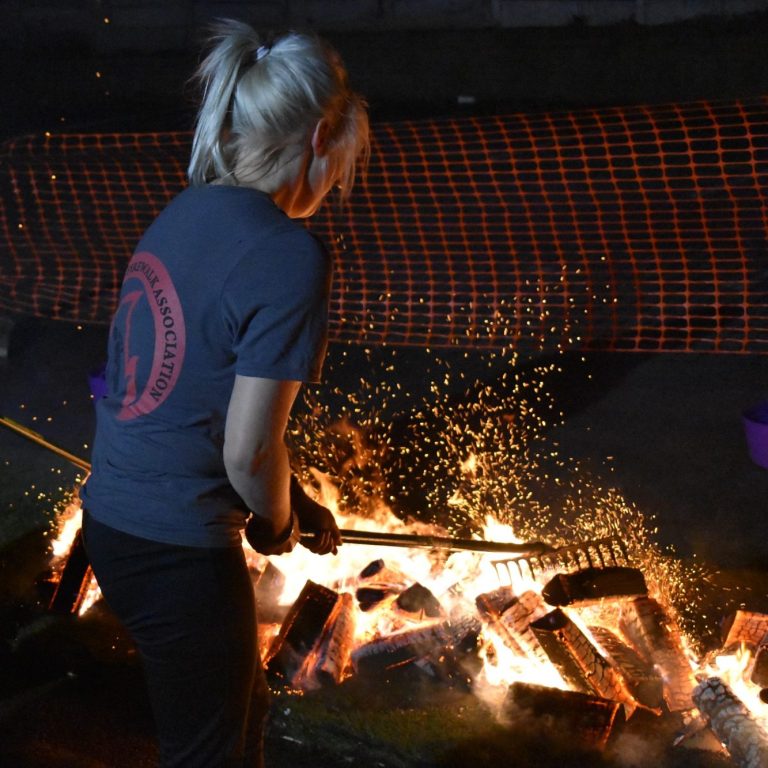 Firewalk Instructor preparing fire 