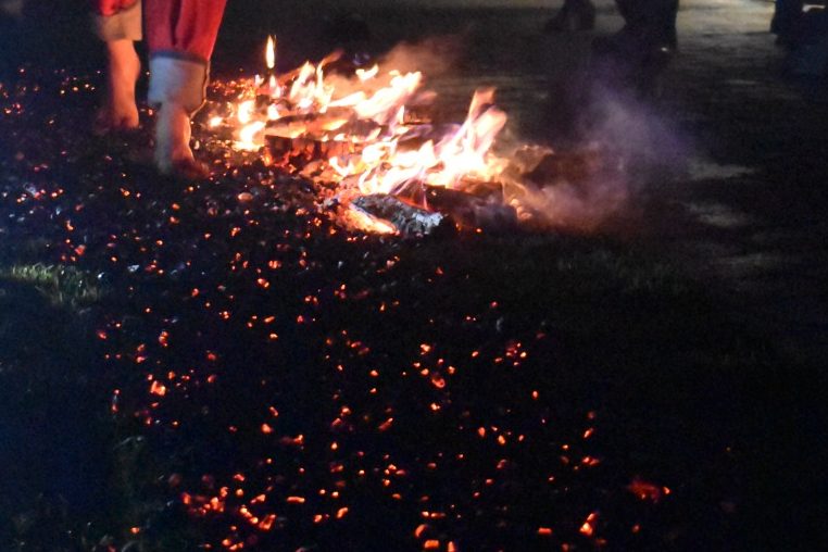 Feet walking on hot coals